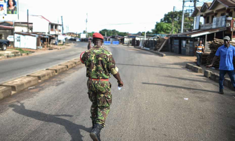 Soldier Patrol Empty Sierra Leone Street During Curfew